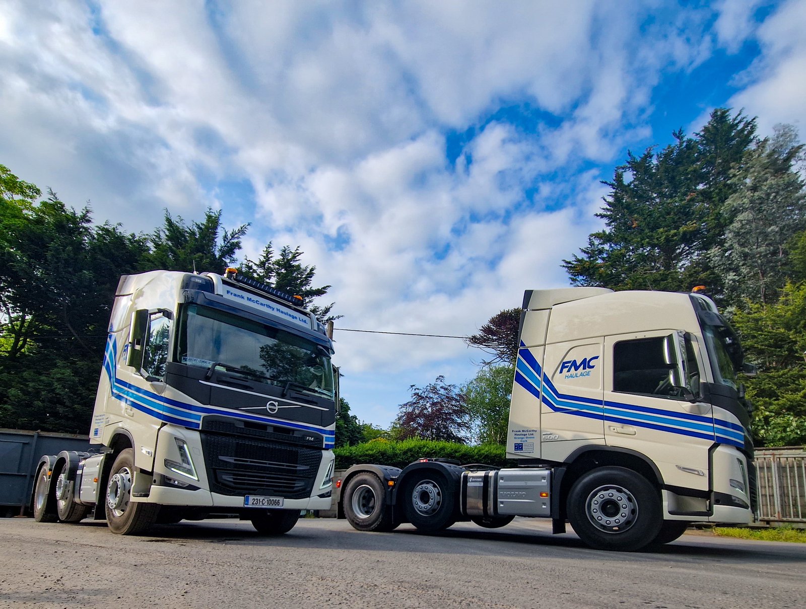 Two FMC trucks parked at the Ovens yard