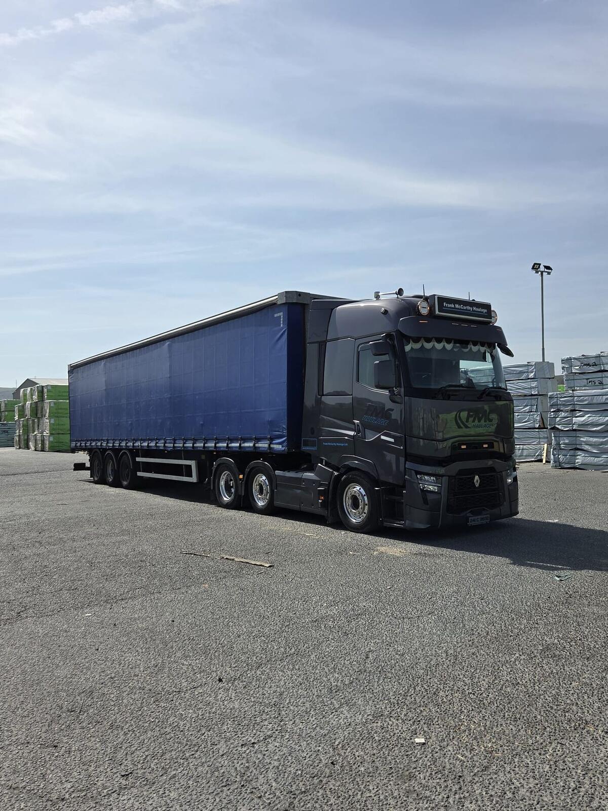 FMC Haulage Renault T High tractor with blue curtainsider trailer loaded with palletised goods at a builders' merchant yard in Cork